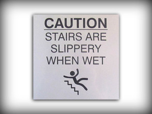 Engraved caution, slippery stairs sign with graphic