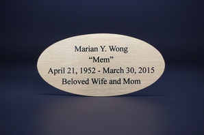 Sublimated brass memorial plate / plaque with black letters, cut to oval shape with custom stand